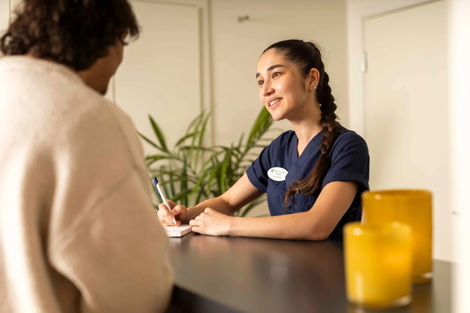 Executive Health clinician speaking with a patient during a private consultation.